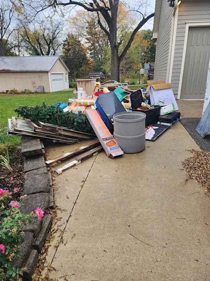 Dumpster being loaded with debris for 3 Yard Dumpster Rental in La Feria